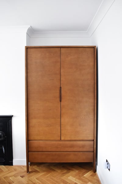 Custom walk-in wardrobe with organized shelving and premium hardware