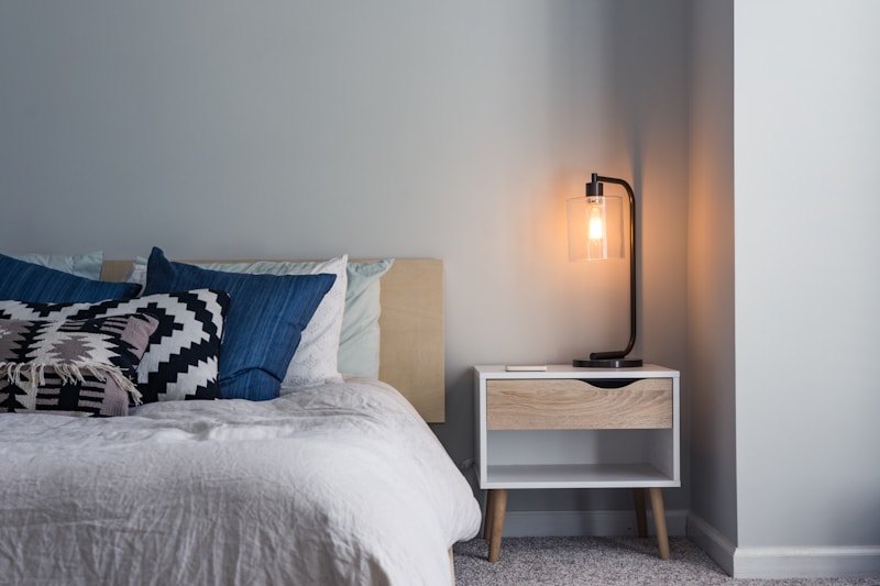 Luxury master bedroom with upholstered bed and ambient lighting
